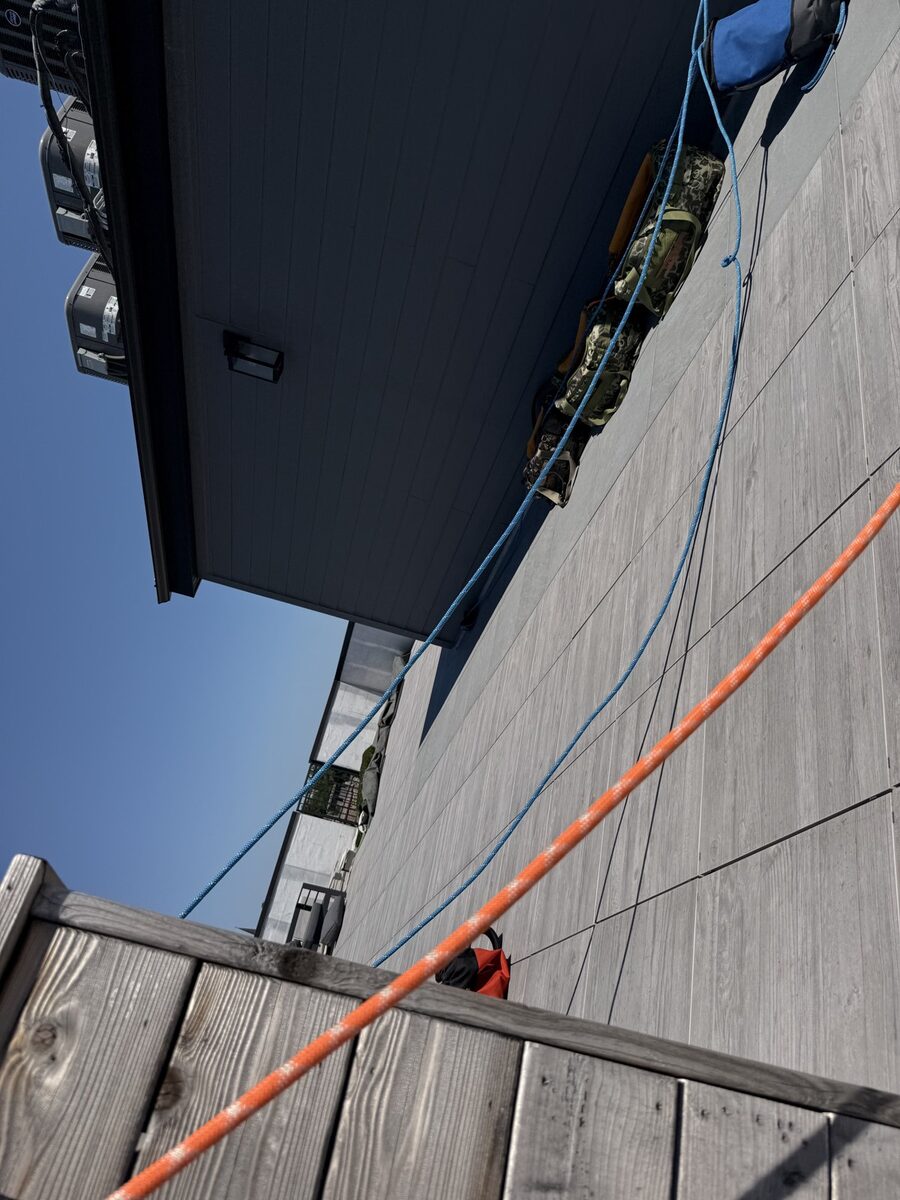 Rope anchor rigged at a Chicago roof edge